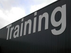 Bold white letters say "training" against a grey background.