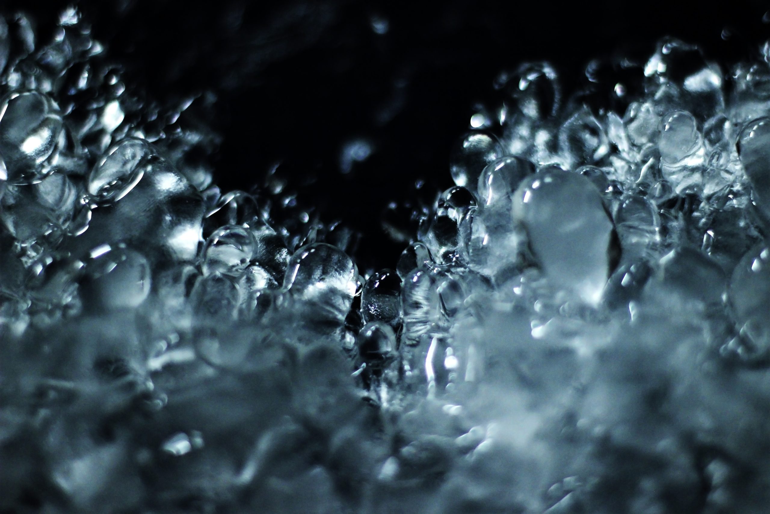 A watery texture is rising up against a black background.